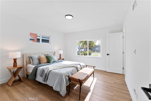2514 S Rita Way, Santa Ana, CA 92704 - bedroom with light wood-style flooring and baseboards