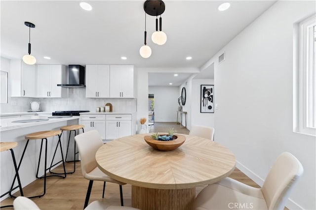 2514 S Rita Way, Santa Ana, CA 92704 - dining space featuring light wood finished floors, recessed lighting, and baseboards