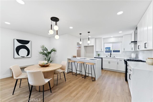 2514 S Rita Way, Santa Ana, CA 92704 - dining space with light wood-type flooring, recessed lighting, and baseboards