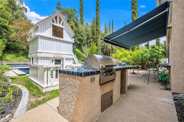 24441 Indian Hill Ln, West Hills, CA 91307 - view of patio / terrace featuring exterior kitchen