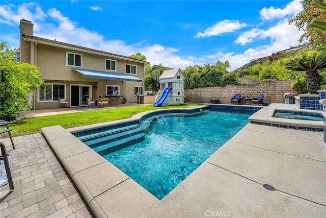 24441 Indian Hill Ln, West Hills, CA 91307 - view of swimming pool with a patio area, an in-ground hot tub, and a playground