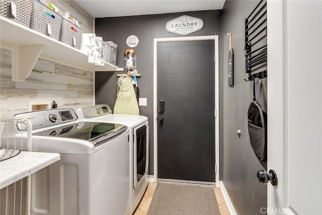 25515 Mountain Springs St, Menifee, CA 92584 - washroom with washer and clothes dryer, light tile patterned flooring, and baseboards