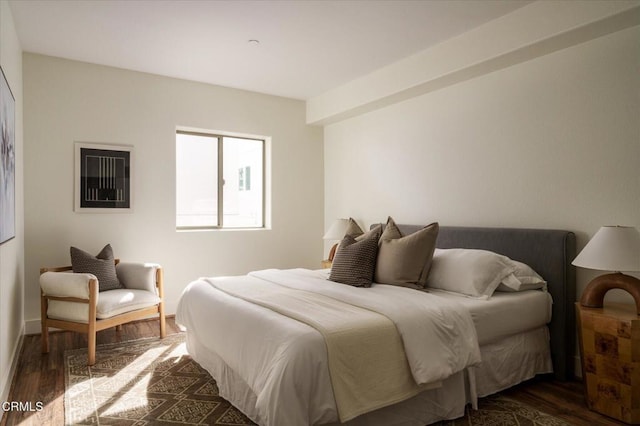 bedroom featuring dark wood-type flooring