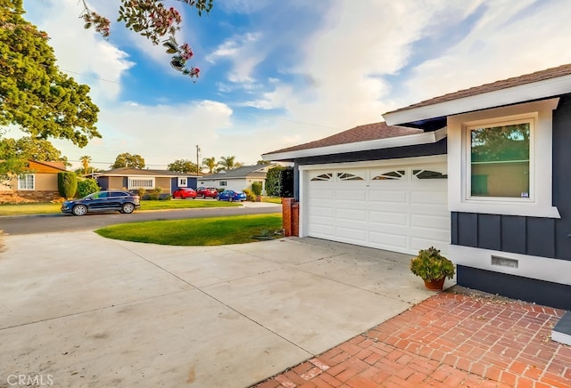 garage featuring driveway