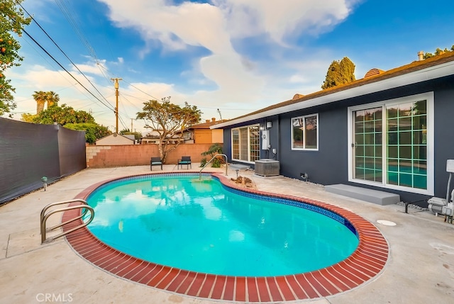 view of pool with a patio and a fenced backyard