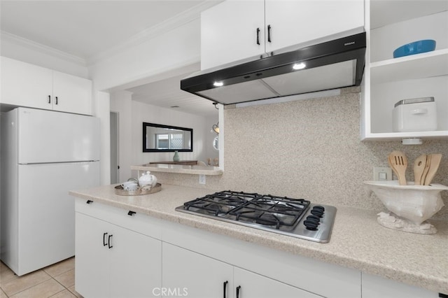 1710 Plaza Del Norte, Newport Beach, CA 92661 - kitchen featuring freestanding refrigerator, extractor fan, stainless steel gas stovetop, ornamental molding, and decorative backsplash