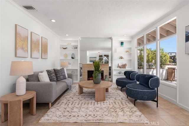 1710 Plaza Del Norte, Newport Beach, CA 92661 - living area with ornamental molding, built in features, light tile patterned floors, a fireplace, and a textured ceiling