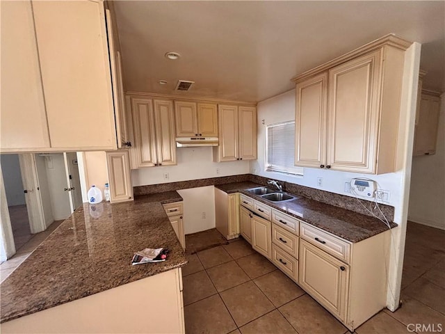2413 Maynard Dr, Duarte, CA 91010 - kitchen featuring a sink, light tile patterned flooring, under cabinet range hood, and cream cabinetry