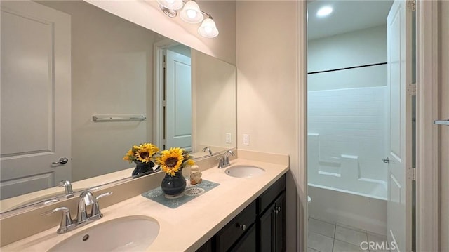 14247 Symphony Ct, Eastvale, CA 92880 - full bathroom featuring double vanity, tile patterned floors, and washtub / shower combination