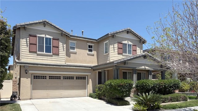 14247 Symphony Ct, Eastvale, CA 92880 - craftsman-style house featuring an attached garage, driveway, and stucco siding