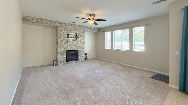 14247 Symphony Ct, Eastvale, CA 92880 - unfurnished living room with ceiling fan, a stone fireplace, carpet, and baseboards