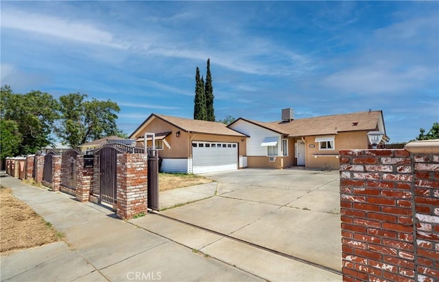 38714 Puerta Ave, Palmdale, CA 93550 - ranch-style house with driveway, stucco siding, a garage, and a gate