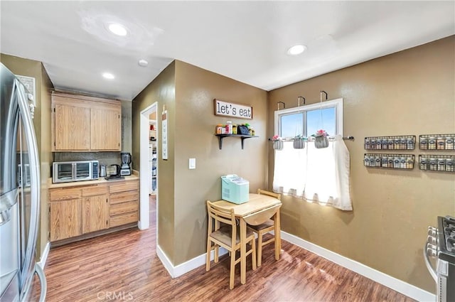 38714 Puerta Ave, Palmdale, CA 93550 - kitchen with stainless steel appliances, light brown cabinetry, baseboards, light wood-type flooring, and recessed lighting