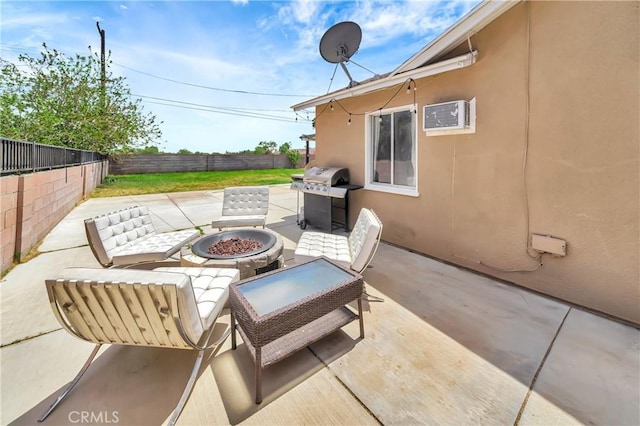 38714 Puerta Ave, Palmdale, CA 93550 - view of patio with grilling area, a fire pit, a wall unit AC, and a fenced backyard