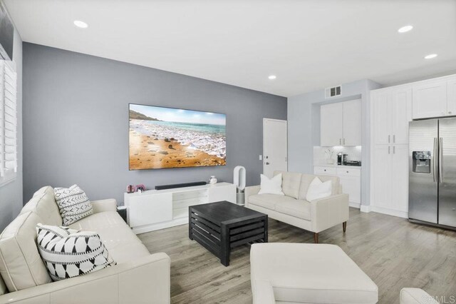 1444 Wooden Valley St, Chula Vista, CA 91913 - living room featuring light wood finished floors and recessed lighting