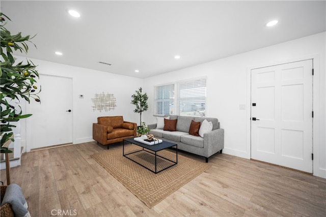 6131 Chickasaw Dr, Westminster, CA 92683 - living area featuring light wood-style floors, recessed lighting, and baseboards