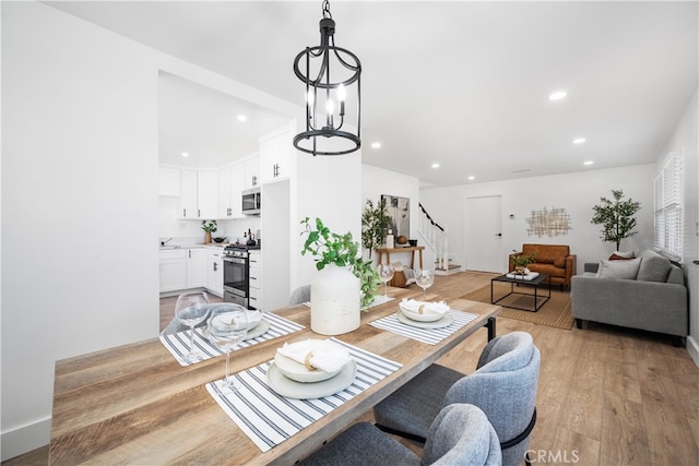 6131 Chickasaw Dr, Westminster, CA 92683 - dining area featuring stairway, light wood-style flooring, recessed lighting, and a chandelier