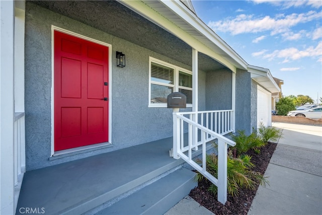 6131 Chickasaw Dr, Westminster, CA 92683 - entrance to property with covered porch, a garage, stucco siding, and concrete driveway