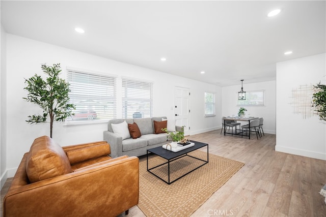 6131 Chickasaw Dr, Westminster, CA 92683 - living room with light wood-style flooring, recessed lighting, a chandelier, and baseboards