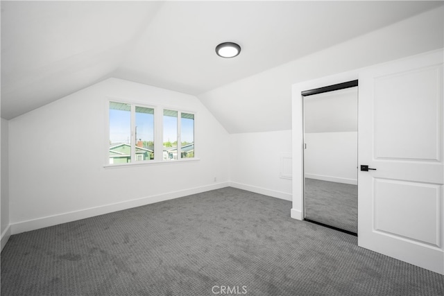 6131 Chickasaw Dr, Westminster, CA 92683 - bonus room featuring dark carpet, vaulted ceiling, and baseboards