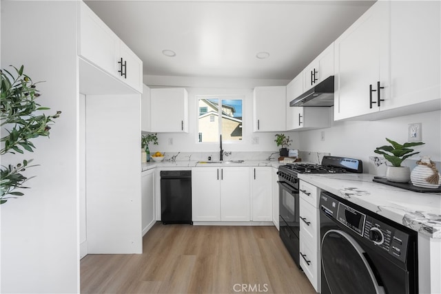 6131 Chickasaw Dr, Westminster, CA 92683 - kitchen with black appliances, under cabinet range hood, a sink, washer / clothes dryer, and light wood-style floors