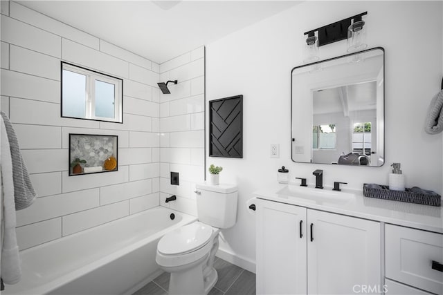 6131 Chickasaw Dr, Westminster, CA 92683 - bathroom featuring toilet, tub / shower combination, vanity, and baseboards