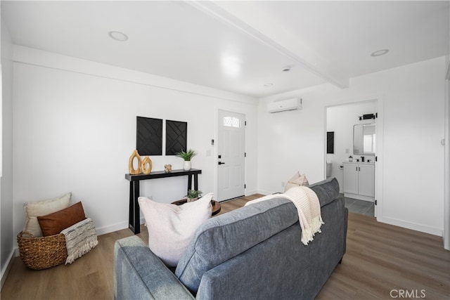 6131 Chickasaw Dr, Westminster, CA 92683 - living room featuring an AC wall unit, wood finished floors, beamed ceiling, and baseboards
