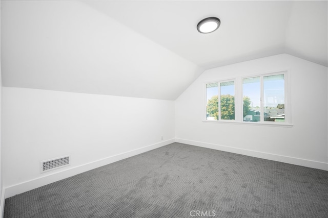6131 Chickasaw Dr, Westminster, CA 92683 - bonus room with lofted ceiling, baseboards, and dark colored carpet