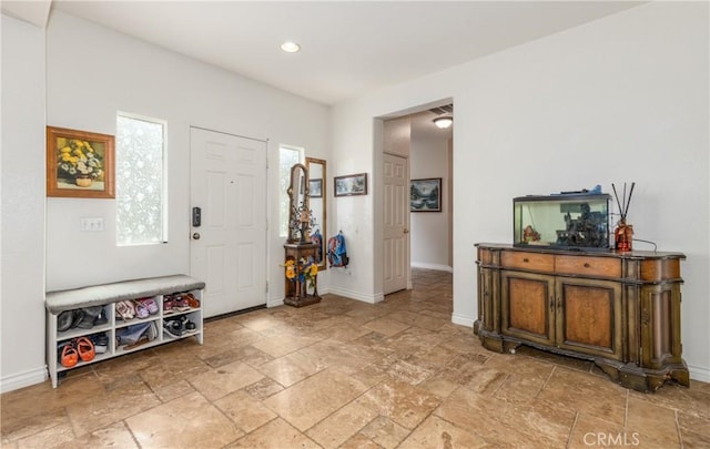 7840 La Cresta St, Highland, CA 92346 - foyer entrance with stone tile flooring, baseboards, and recessed lighting