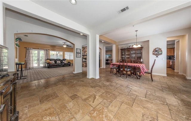 7840 La Cresta St, Highland, CA 92346 - dining room with stone tile flooring, baseboards, arched walkways, ceiling fan, and recessed lighting