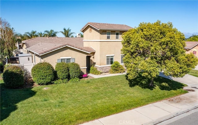 7840 La Cresta St, Highland, CA 92346 - view of front of home featuring a front lawn, stucco siding, and a tile roof