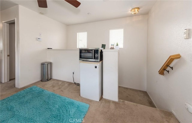 7840 La Cresta St, Highland, CA 92346 - laundry room featuring light colored carpet and a ceiling fan