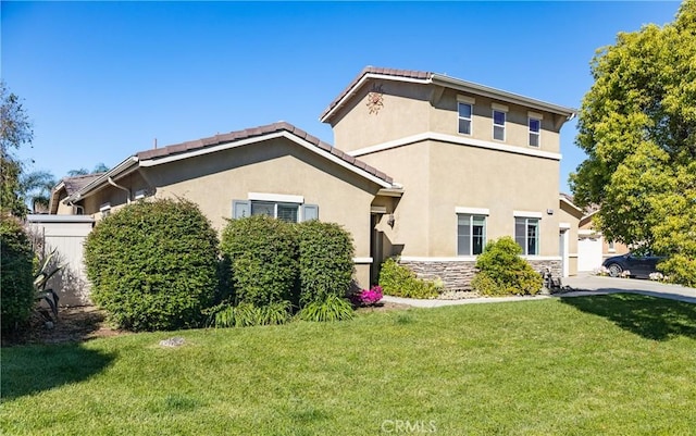 7840 La Cresta St, Highland, CA 92346 - view of front facade featuring a front lawn, stucco siding, and stone siding