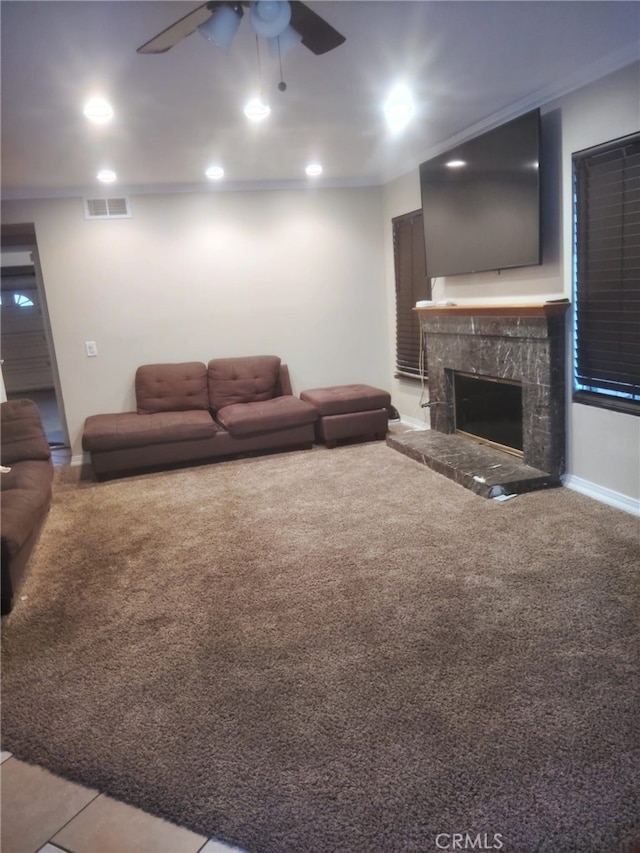 10228 Via Pavon, Moreno Valley, CA 92557 - living area with a ceiling fan, carpet flooring, a fireplace, baseboards, and recessed lighting