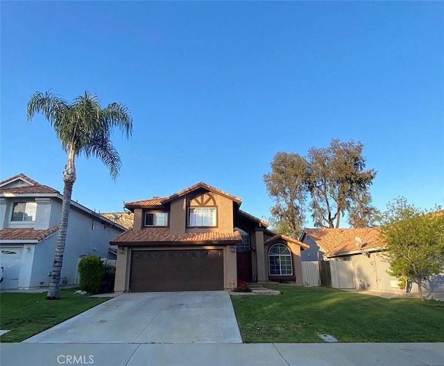 10228 Via Pavon, Moreno Valley, CA 92557 - view of front of property with a garage, driveway, stucco siding, and a tile roof