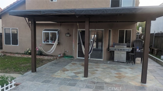 10228 Via Pavon, Moreno Valley, CA 92557 - back of house with stucco siding, a patio area, and fence