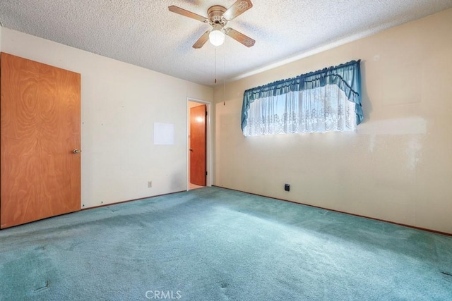 459 Roosevelt St, Coalinga, CA 93210 - carpeted empty room featuring a ceiling fan and a textured ceiling
