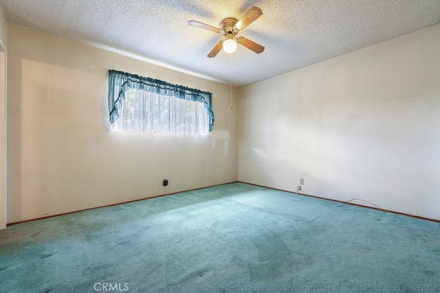459 Roosevelt St, Coalinga, CA 93210 - carpeted spare room featuring a ceiling fan and a textured ceiling