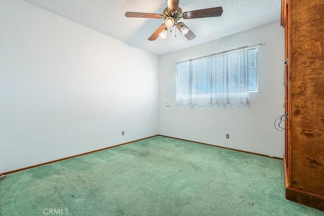 459 Roosevelt St, Coalinga, CA 93210 - carpeted spare room featuring a textured ceiling, a ceiling fan, and baseboards