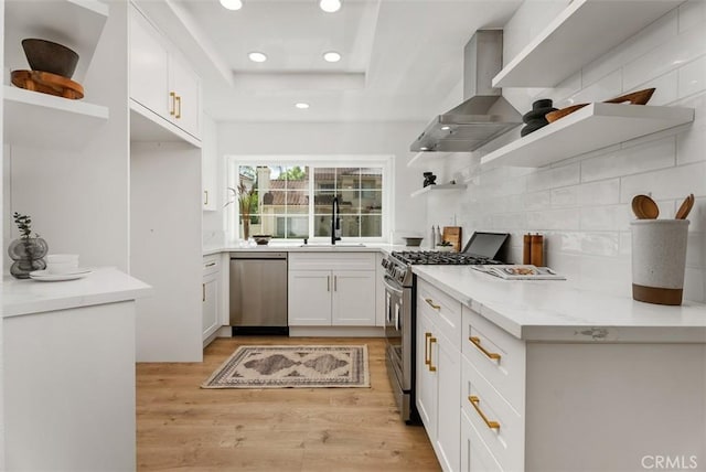 8 Galanto, Irvine, CA 92614 - kitchen with open shelves, appliances with stainless steel finishes, wall chimney range hood, backsplash, and white cabinets