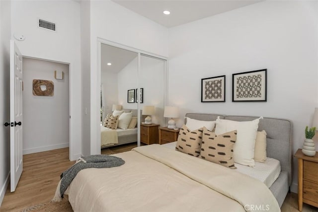 8 Galanto, Irvine, CA 92614 - bedroom with wood finished floors, a closet, baseboards, and recessed lighting