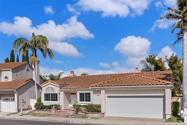 8 Galanto, Irvine, CA 92614 - mediterranean / spanish-style house with stucco siding, a tile roof, an attached garage, and a chimney