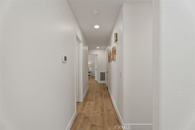 8 Galanto, Irvine, CA 92614 - hallway with recessed lighting, light wood-style flooring, and baseboards