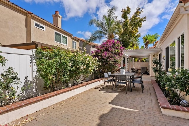 8 Galanto, Irvine, CA 92614 - view of patio featuring a fenced backyard, outdoor dining area, and a pergola