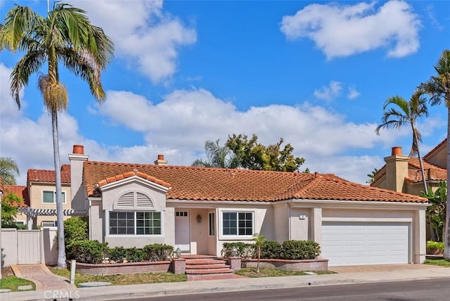 8 Galanto, Irvine, CA 92614 - mediterranean / spanish house with a garage, stucco siding, a tiled roof, fence, and driveway
