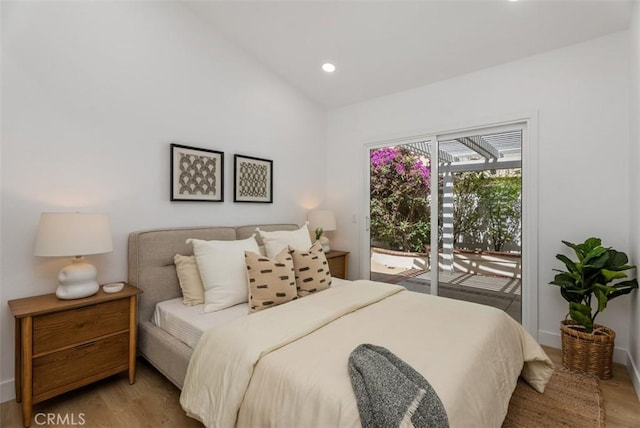 8 Galanto, Irvine, CA 92614 - bedroom featuring access to exterior, vaulted ceiling, wood finished floors, recessed lighting, and baseboards