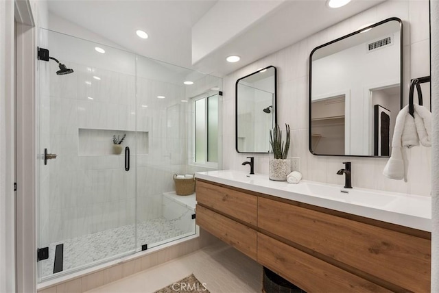 8 Galanto, Irvine, CA 92614 - bathroom with a shower stall, double vanity, and recessed lighting