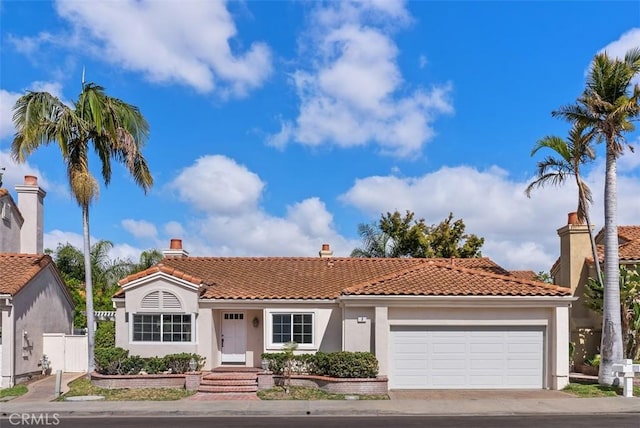 8 Galanto, Irvine, CA 92614 - mediterranean / spanish-style home with a tile roof, stucco siding, an attached garage, driveway, and fence