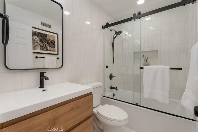 8 Galanto, Irvine, CA 92614 - full bathroom with enclosed tub / shower combo, tile walls, vanity, and toilet