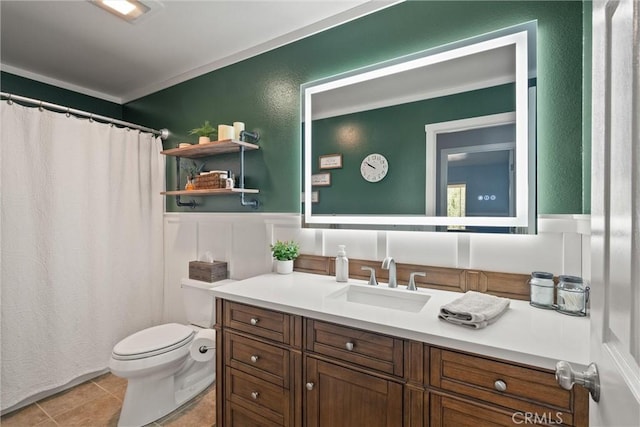 40 Gunter Ln, Oroville, CA 95966 - bathroom with toilet, vanity, wainscoting, tile patterned floors, and a decorative wall